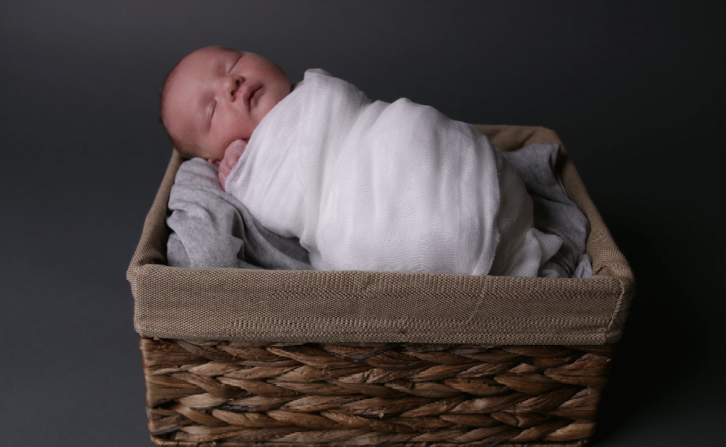 Here’s When You Should Stop Swaddling Your Baby, According To Experts